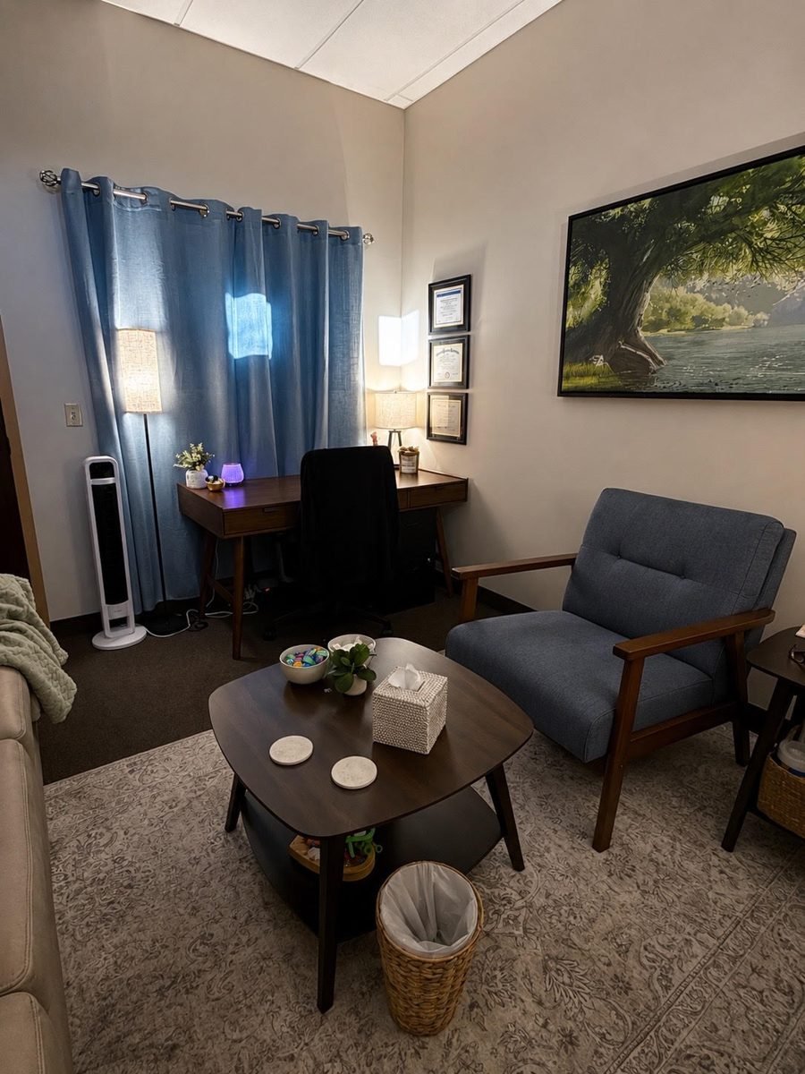 Robin's counseling office with desk and framed credentials