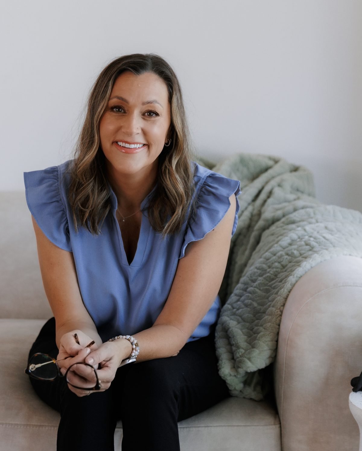 Robin seated in her Glendale, Arizona therapy office, ready for a first session
